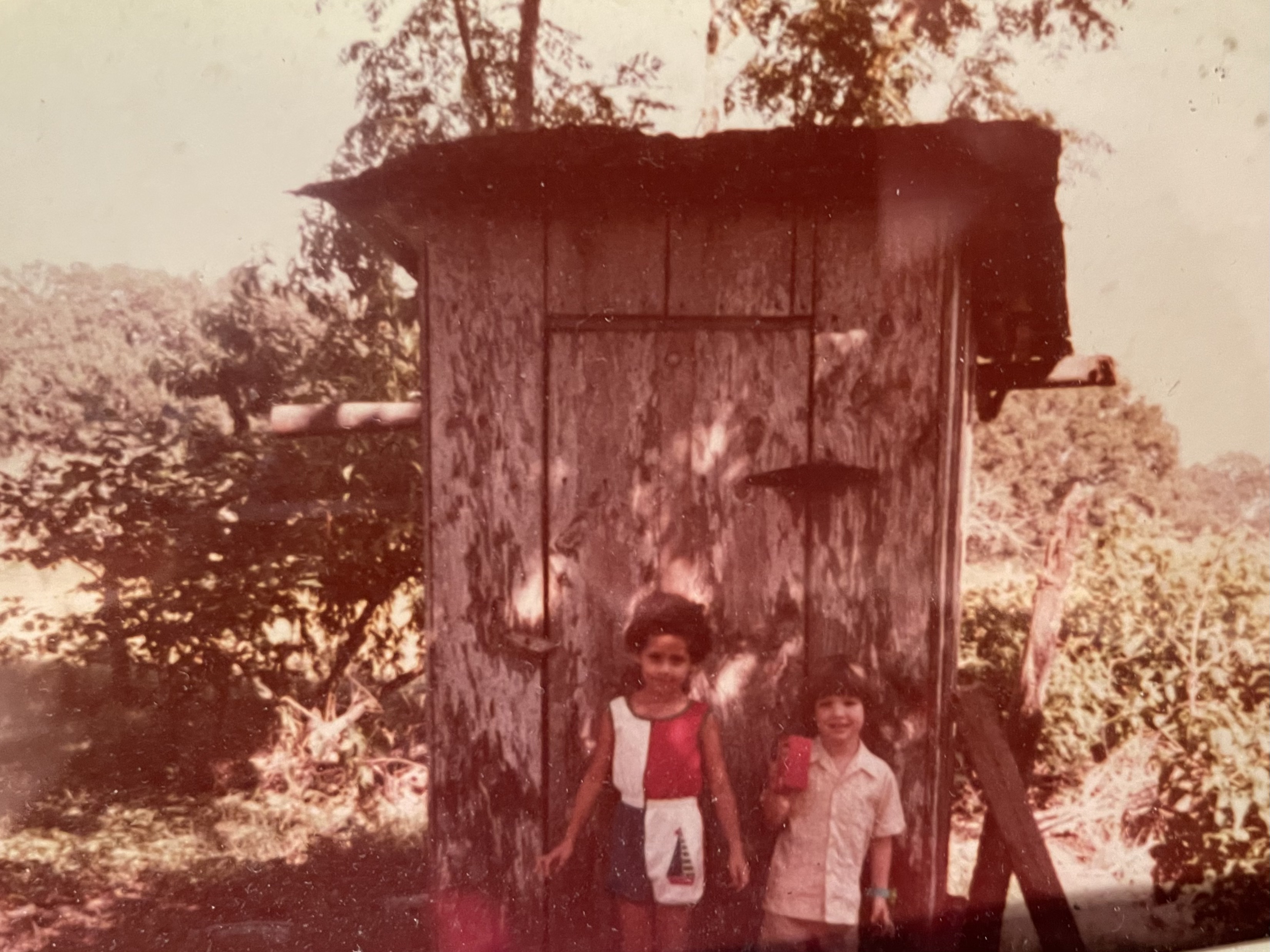 My cousin and I outside the Fridel outhouse